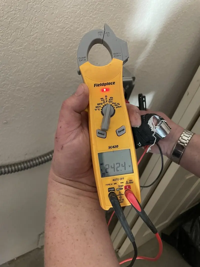 Voltage testing with clamp meter during Aluminum Wiring Replacement in Clay